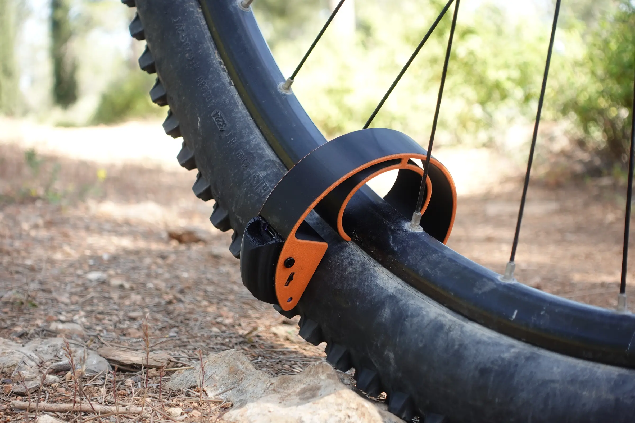 The SealSense unit clipped onto a mountain-bike tire